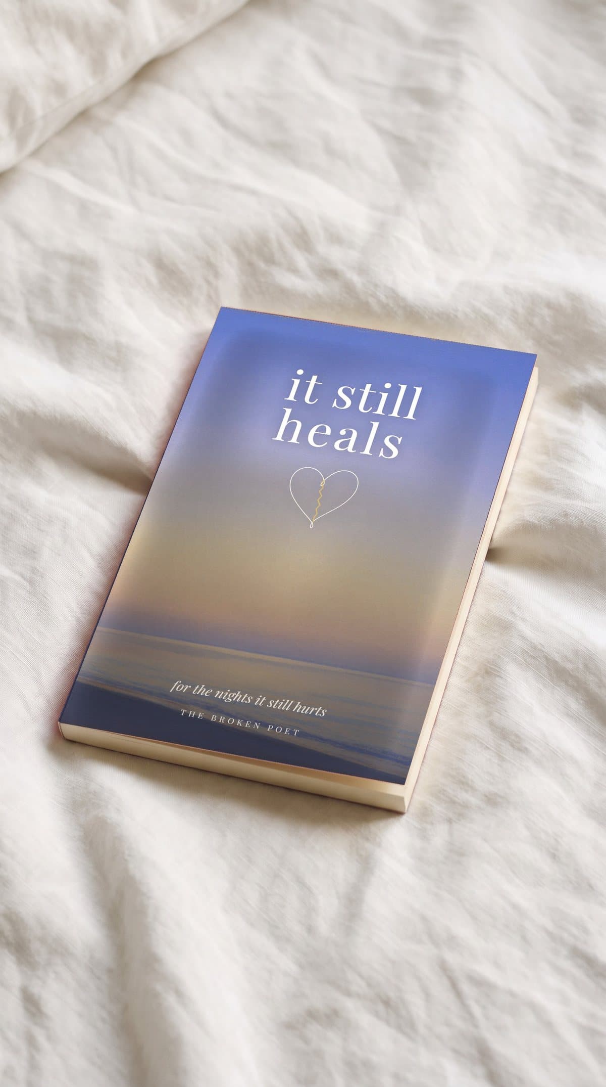 it still heals, lying on white bedsheets